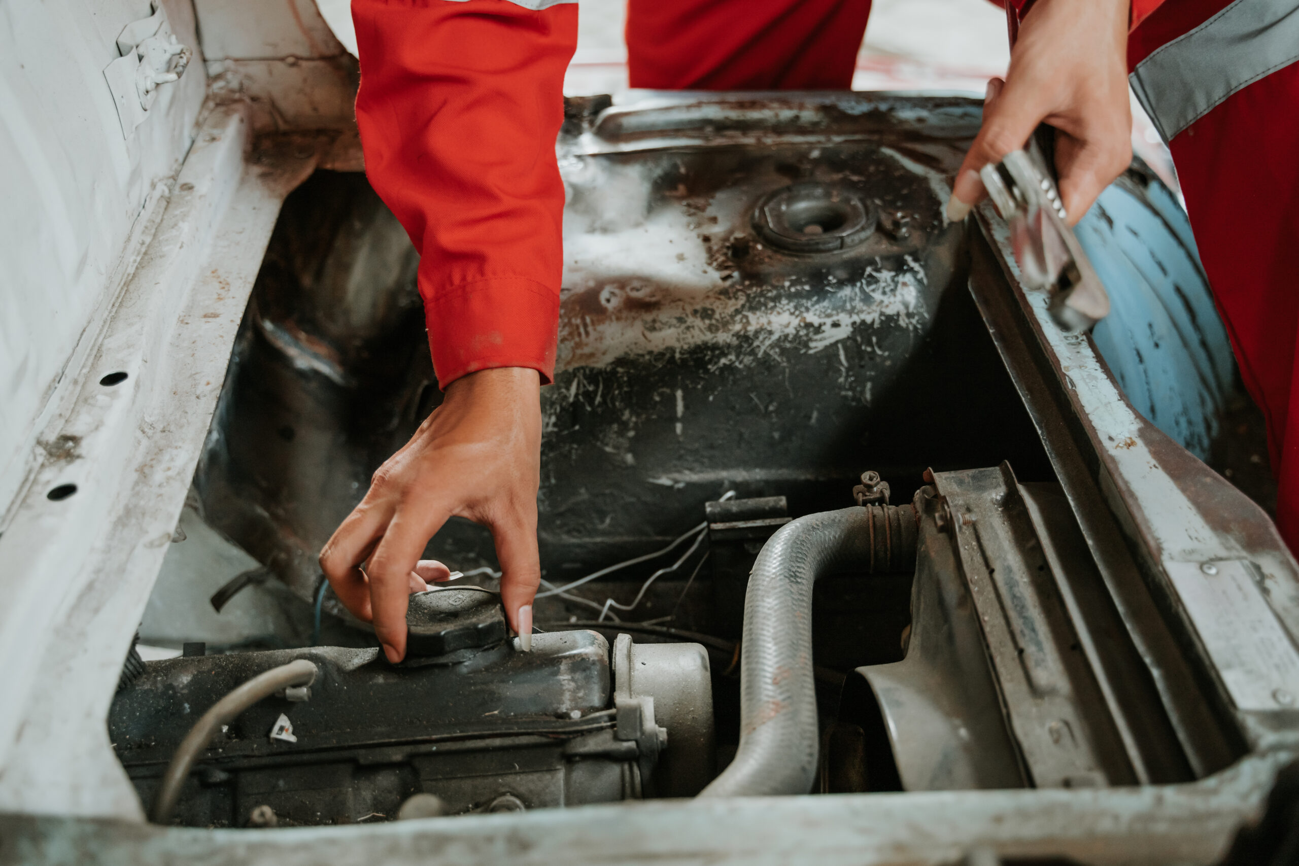 hand gesture of man check oil in the car coolant car engine detail / close up of machine new engine motor checking and cleaning for deliver customers in the car service